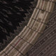 Saree styled; black Sambalpuri cotton saree with grey motifs showcased in a draped presentation.