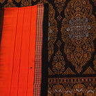Full view of a Bomkai cotton saree in orange with black butta pattern