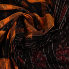 Stylishly draped yellow Sambalpuri cotton saree with black motifs
