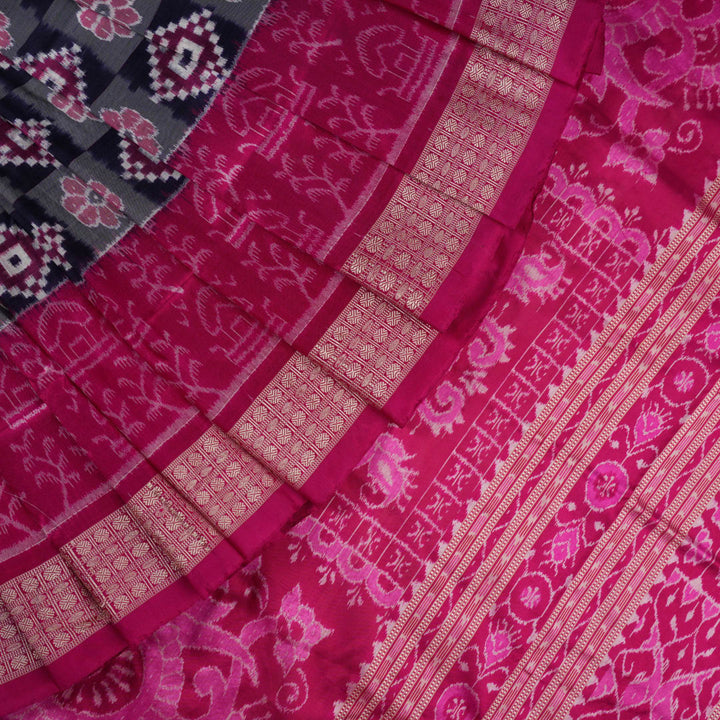 Detail of the luxurious silk texture and exquisite handloom weave of the Multi-color Pink Sambalpuri Saree.
