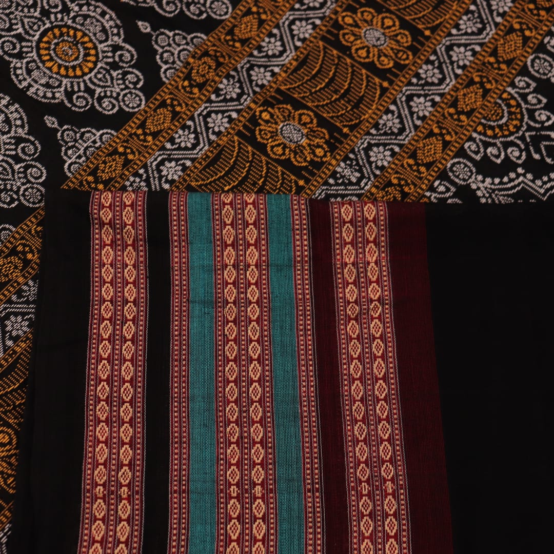 Full view of a blue and black Bomkai cotton saree with intricate butta pattern.