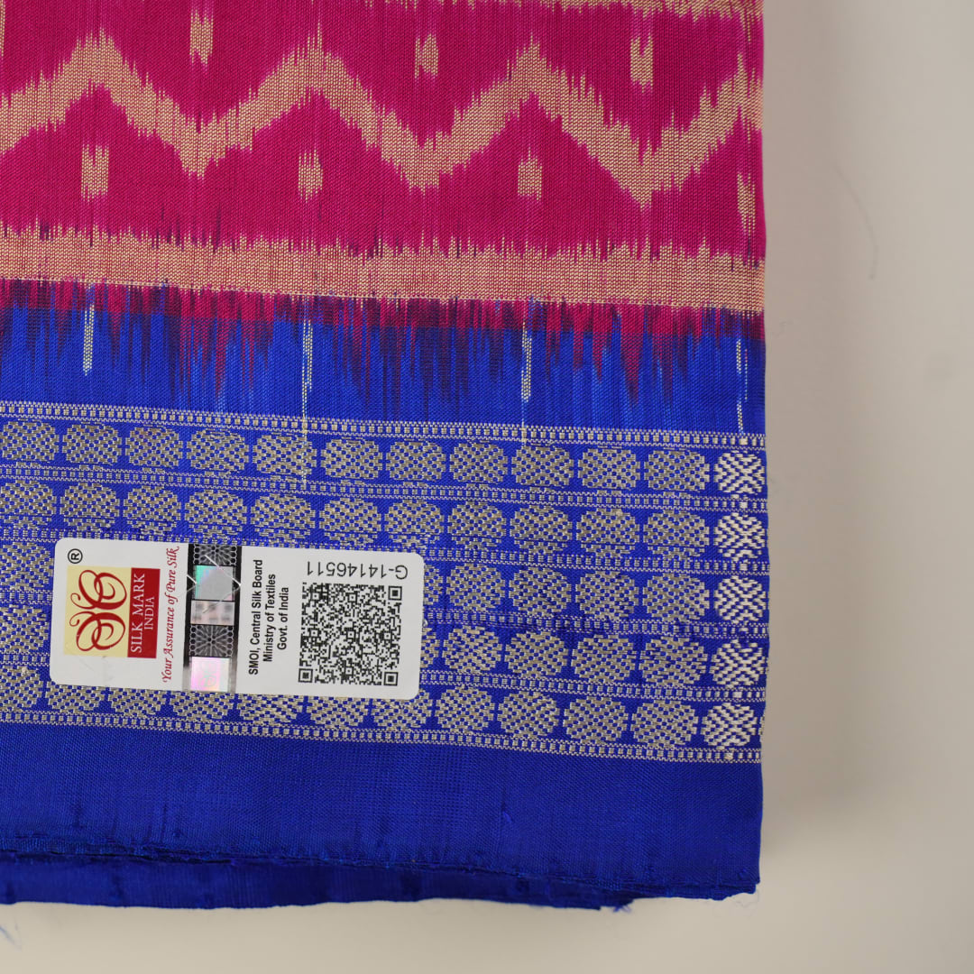 Close-up of Sambalpuri silk fabric texture, revealing the fine handloom weave and quality.