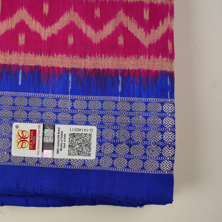 Close-up of Sambalpuri silk fabric texture, revealing the fine handloom weave and quality.