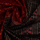 Close-up showing the fine silk texture and intricate motifs of the Sambalpuri saree