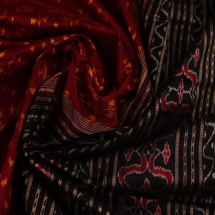 Close-up showing the fine silk texture and intricate motifs of the Sambalpuri saree