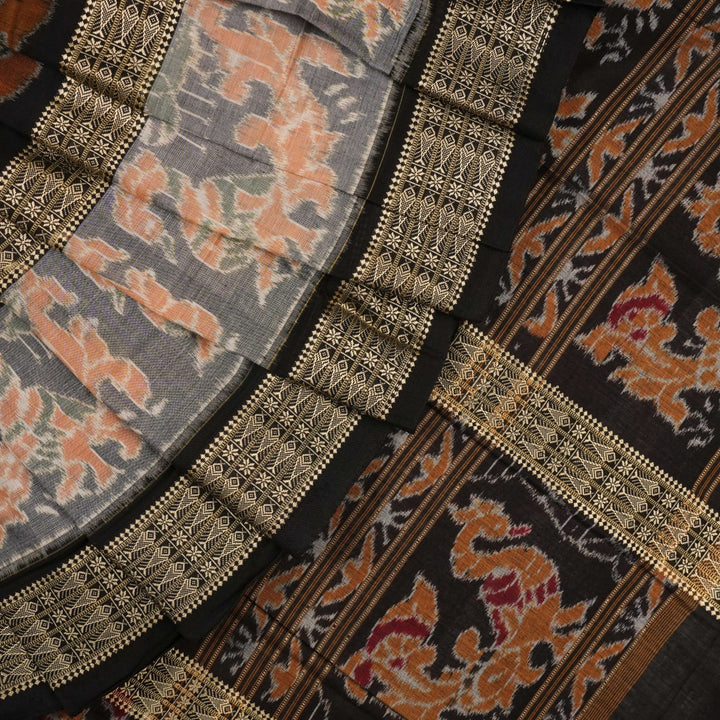 Full layout of green and black Sambalpuri cotton saree showcasing the complete pattern and motifs.