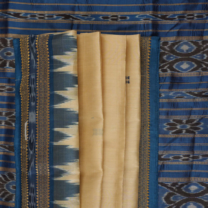 Elegant styling of cream and blue Khandua silk saree with butta pattern on model for traditional look
