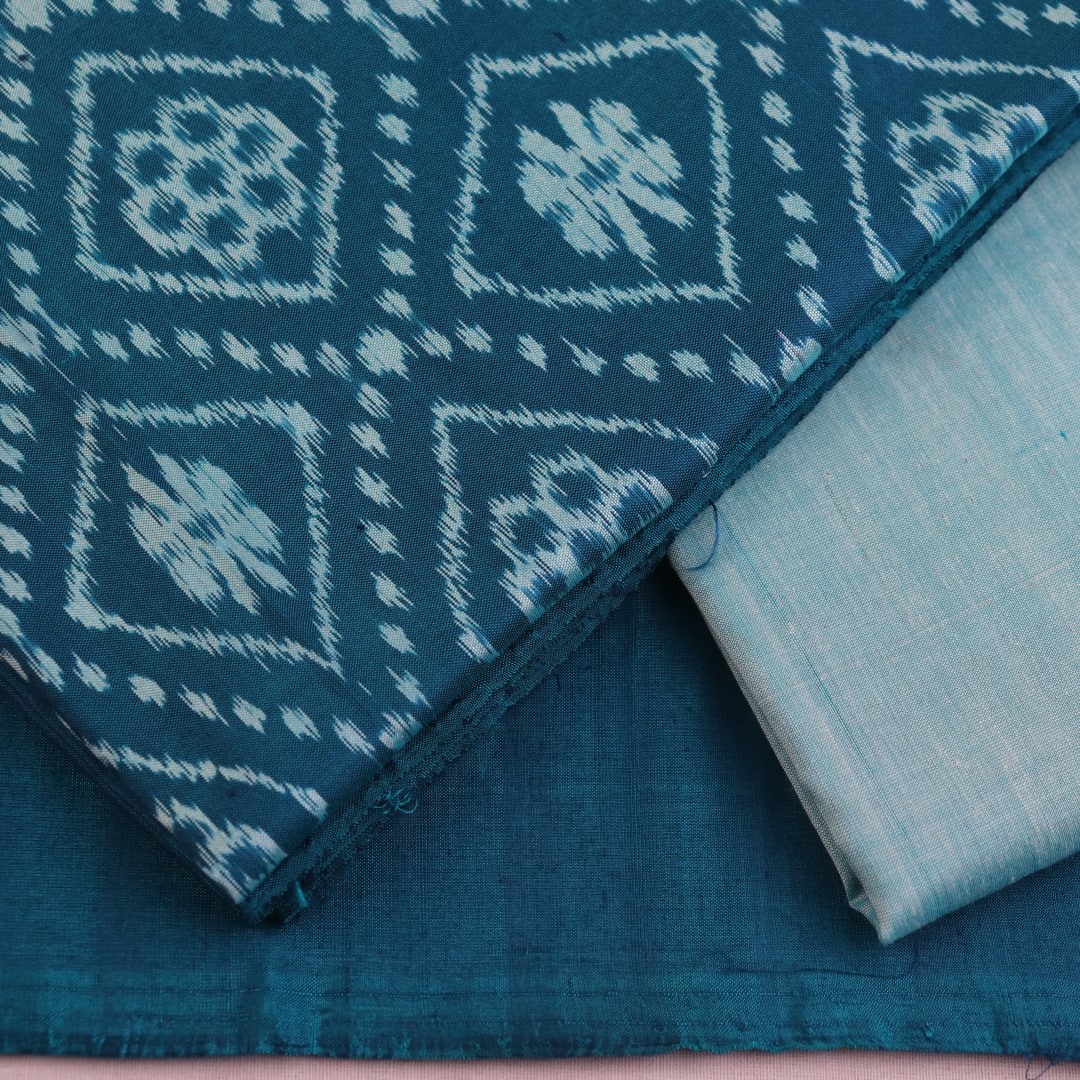 Detail of blue Sambalpuri silk dress material blouse piece with motifs.
