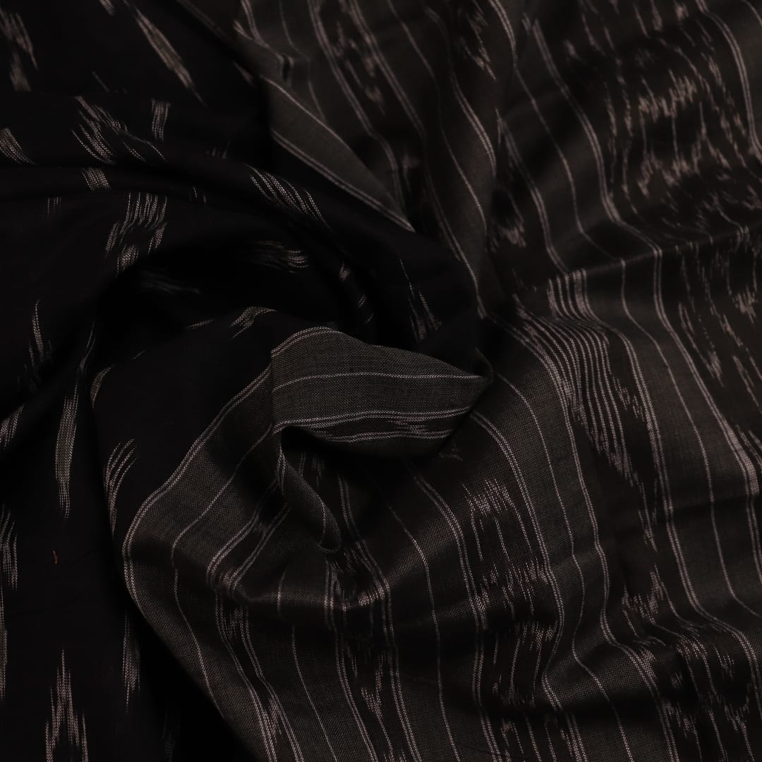 Saree styled; black Sambalpuri cotton saree with grey motifs showcased in a draped presentation.