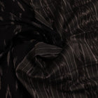 Saree styled; black Sambalpuri cotton saree with grey motifs showcased in a draped presentation.