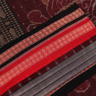 Full view of grey Bomkai cotton saree, featuring black border and butta pattern.