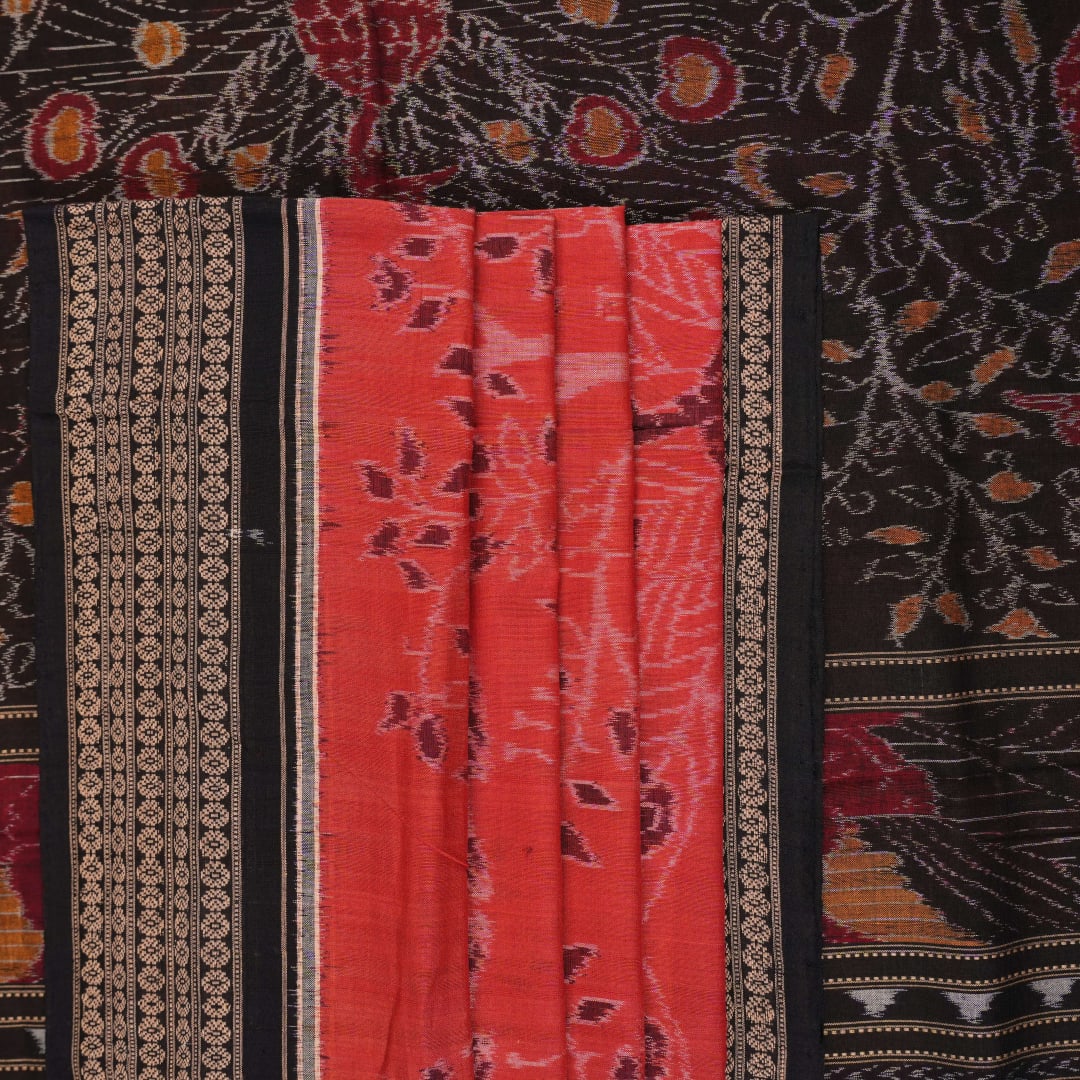 Full layout view of a rust and black Sambalpuri cotton saree displaying the complete body pattern and motifs.