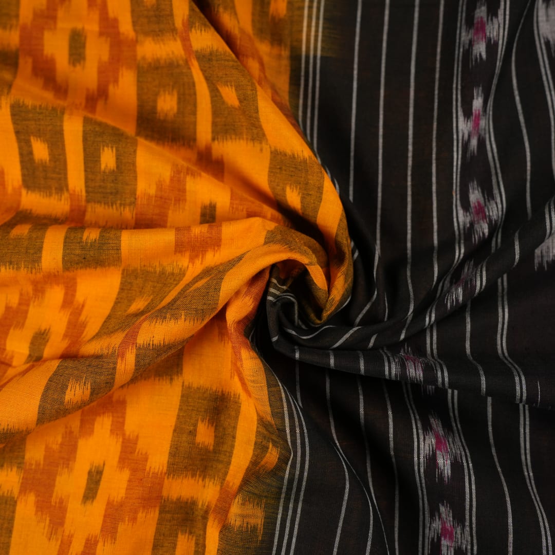 Professional styling of the yellow and black Sambalpuri cotton saree with traditional motifs shown on a model.