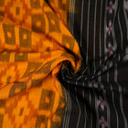 Professional styling of the yellow and black Sambalpuri cotton saree with traditional motifs shown on a model.