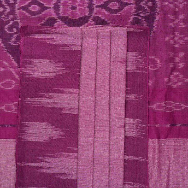 Model draped in a plain pink Sambalpuri cotton saree, styled to show the graceful fall and elegant border.