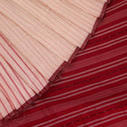 Entire white and maroon striped Sambalpuri cotton saree laid out.