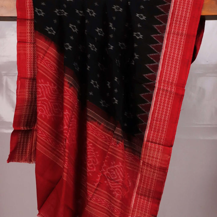 Stylish black dupatta with red motifs, draped elegantly on a model.