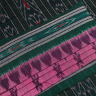 Pink and green Sambalpuri cotton saree with motifs, elegantly draped on a model.