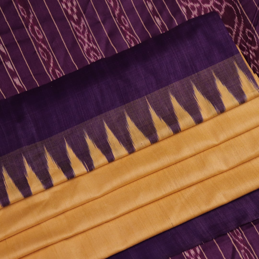 Close-up of cream tussar silk saree fabric with plain weave texture