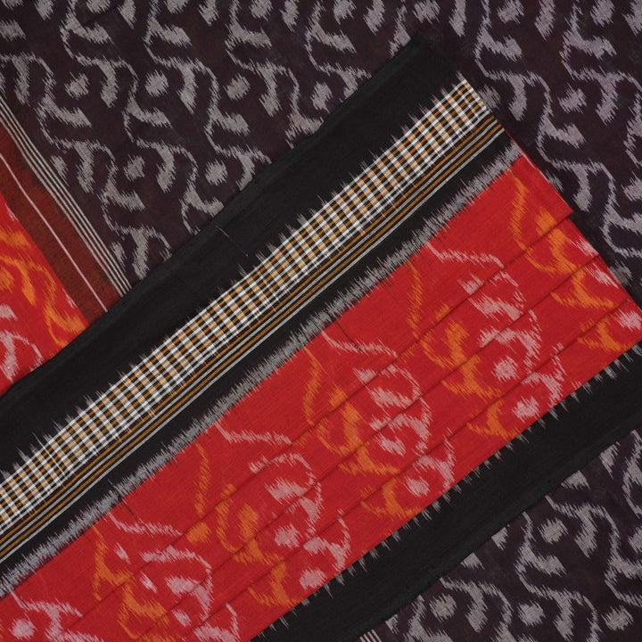 Model draped in a maroon and black Sambalpuri cotton saree showcasing elegant traditional handloom style