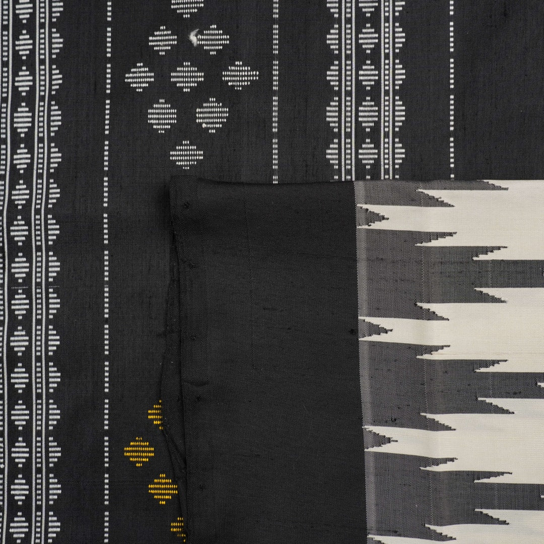 Close-up of the luxurious Berhampuri Silk Saree fabric, revealing the fine weave and soft texture.