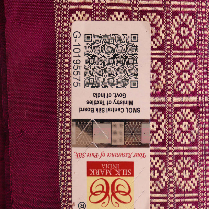 Close-up of silk fabric with intricate Sambalpuri motif design in multicolor and purple hues