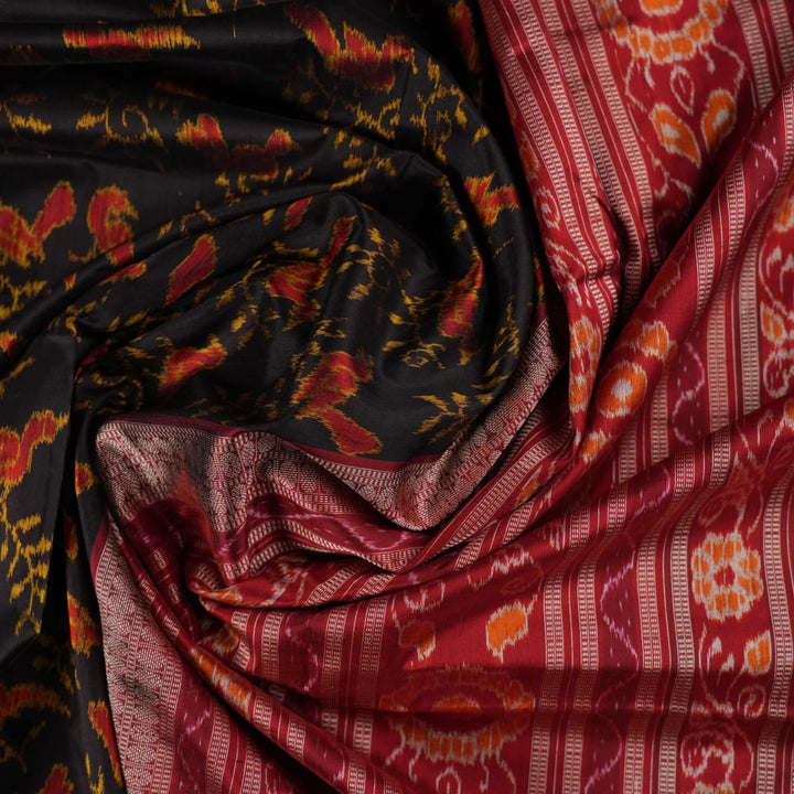 Close-up of Sambalpuri silk fabric texture, highlighting fine handloom weave in black and maroon.