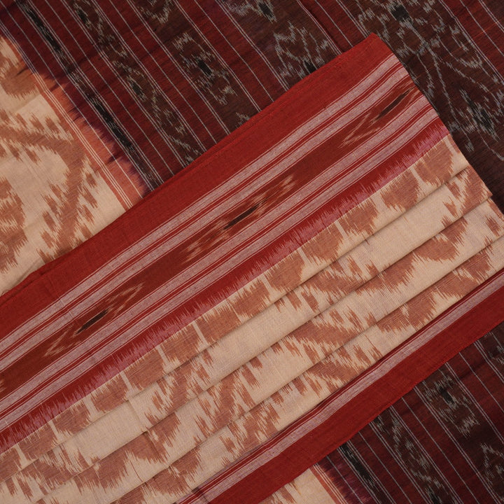 Traditional styling of a cream and rust Sambalpuri cotton saree draped on a model for a classic look.