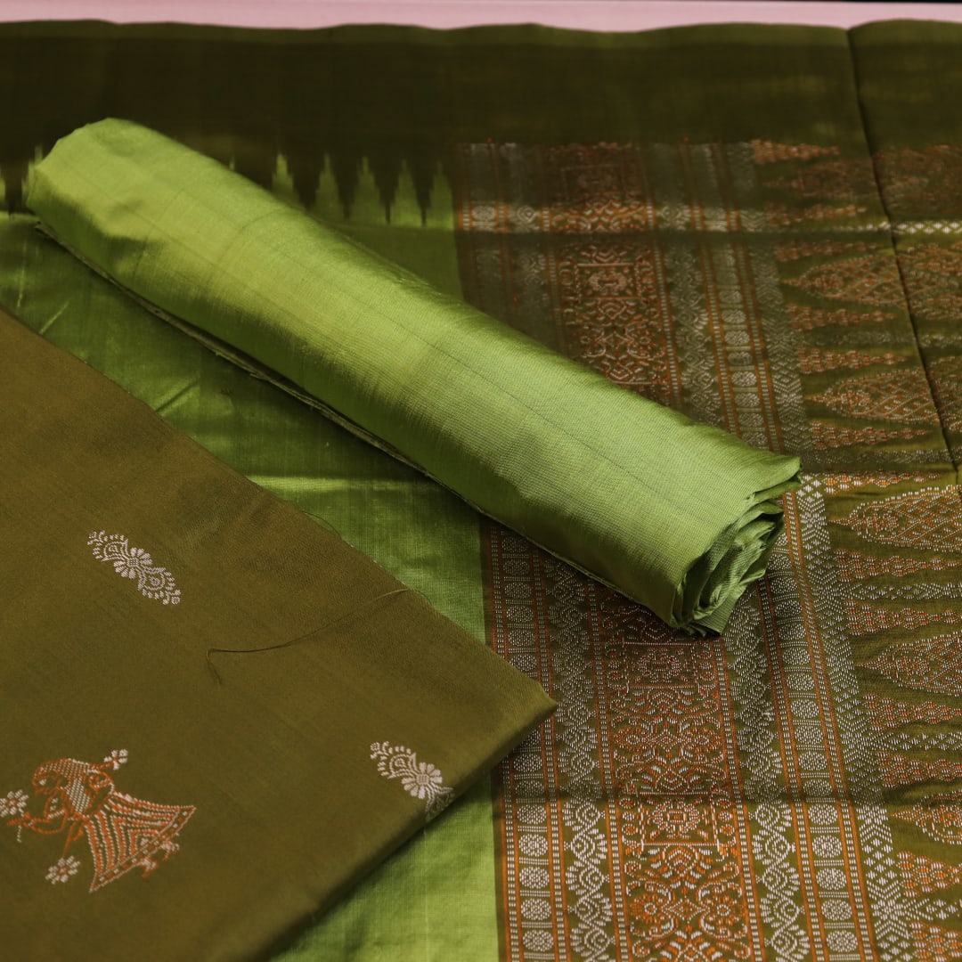 Close-up of the green Bomkai silk dress material's blouse piece with butta pattern.