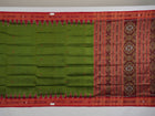 Model draped in a green and red Khandua silk saree with traditional butta work and rich border.