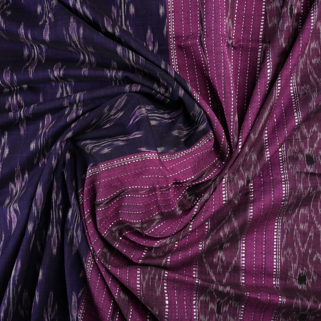 Full styling view of a model draped in a blue and purple Sambalpuri cotton saree with ikat motifs.