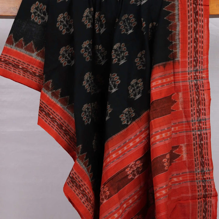 Black cotton Sambalpuri dupatta with rust motifs, styled on a mannequin