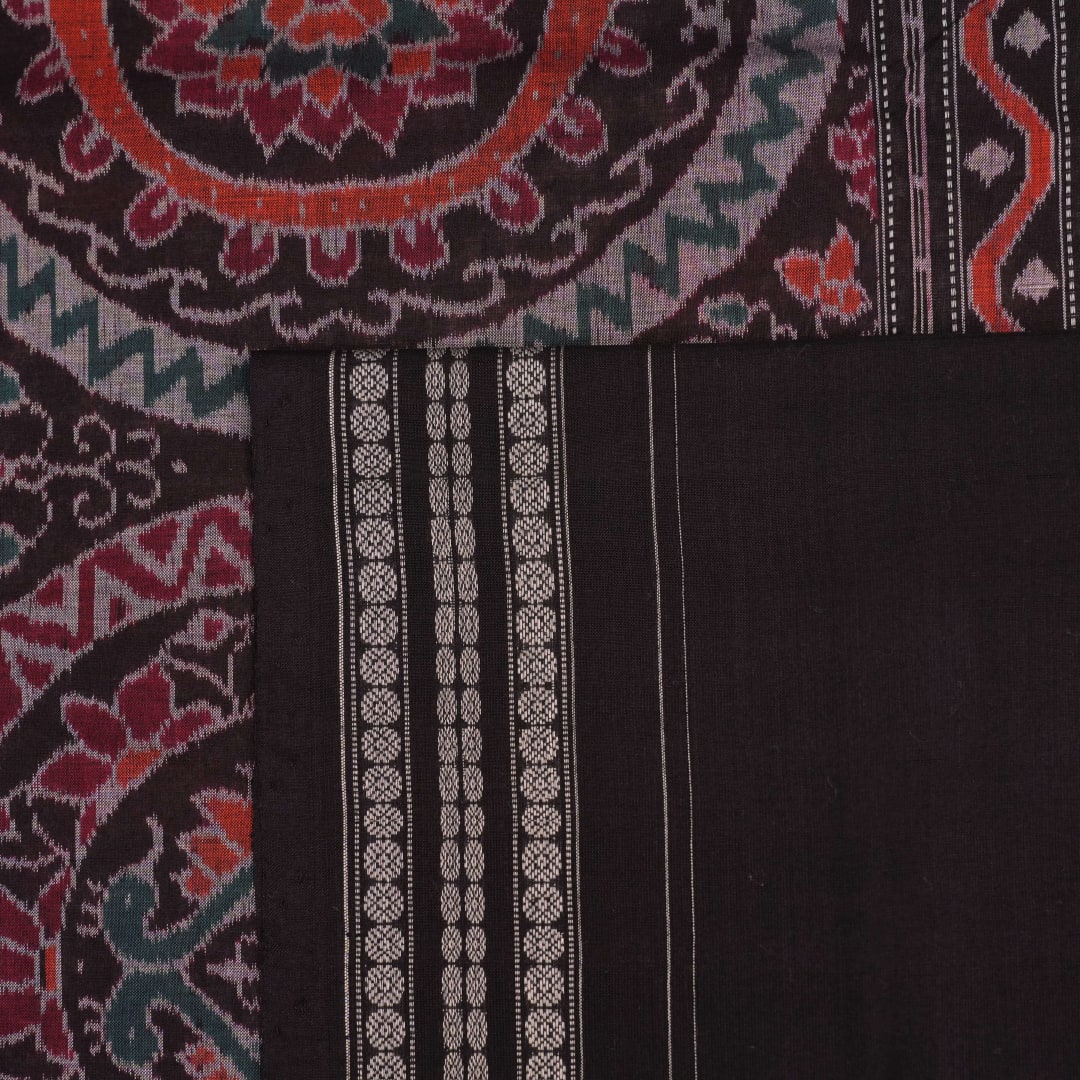 Full length flat layout of a brown and multi color Sambalpuri cotton saree highlighting the complete pattern.
