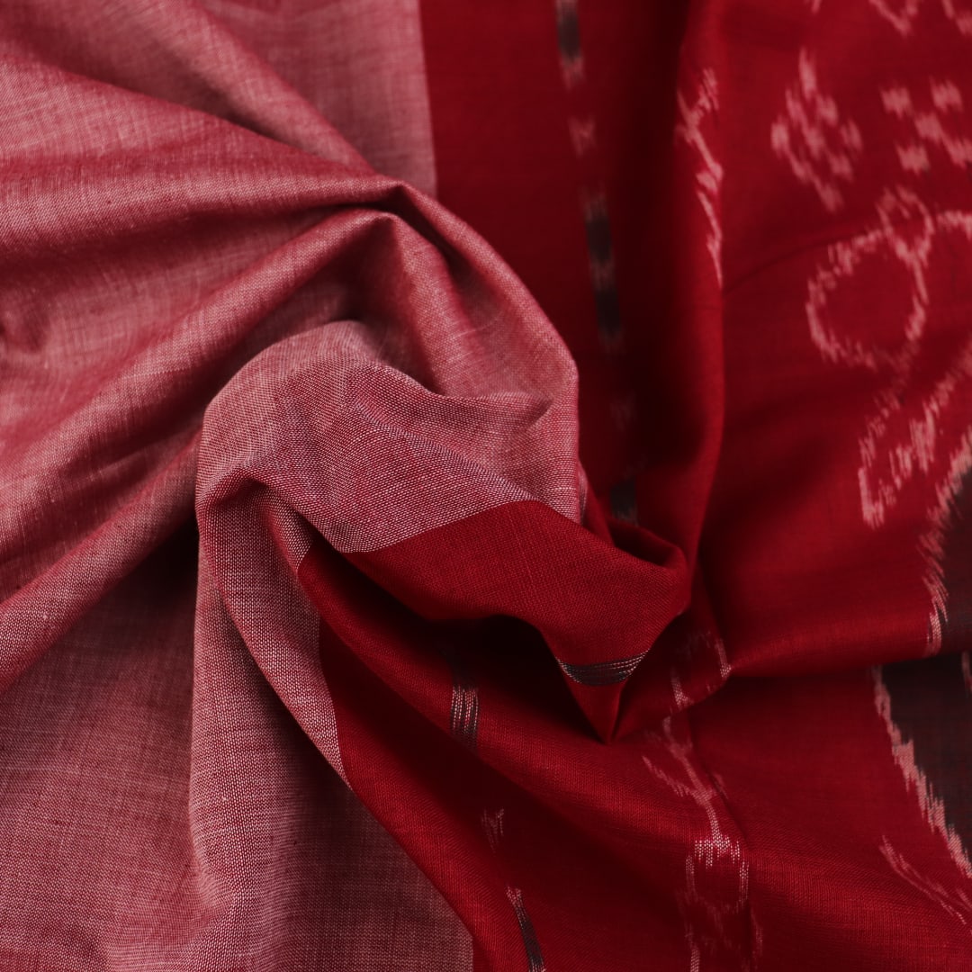 Draped multi-color Sambalpuri cotton saree with maroon highlights and plain body.