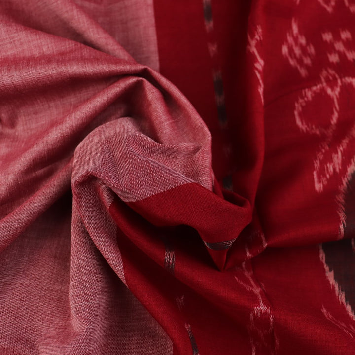 Draped multi-color Sambalpuri cotton saree with maroon highlights and plain body.