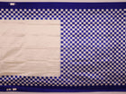 Close-up of the intricate Pasapalli pattern woven on a luxurious white silk Sambalpuri saree with blue accents.