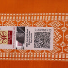 Close-up of Bomkai silk saree fabric texture in white with yellow butta pattern.