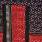 Model draped in a maroon and black Sambalpuri cotton saree showcasing elegant traditional handloom style