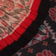 Styled cream Sambalpuri cotton saree with black motifs, highlighting its elegant drape and design.