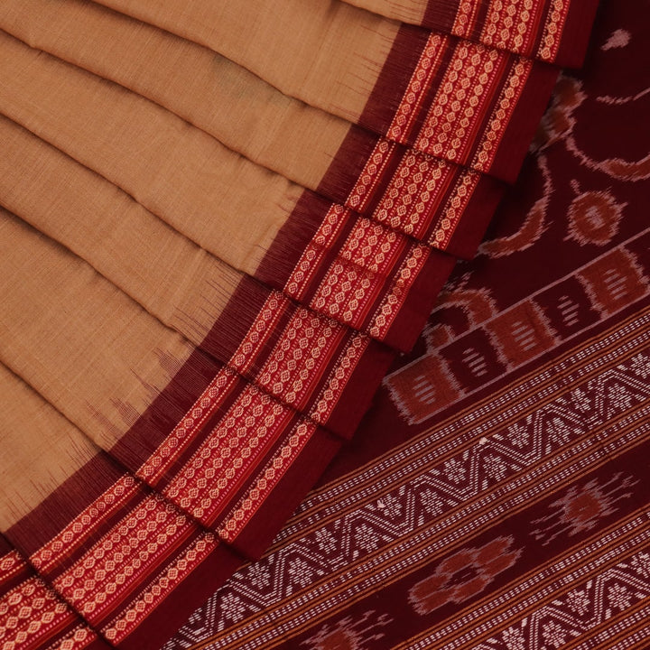 Full view of a traditional brown and maroon Bomkai cotton saree with butta patterns