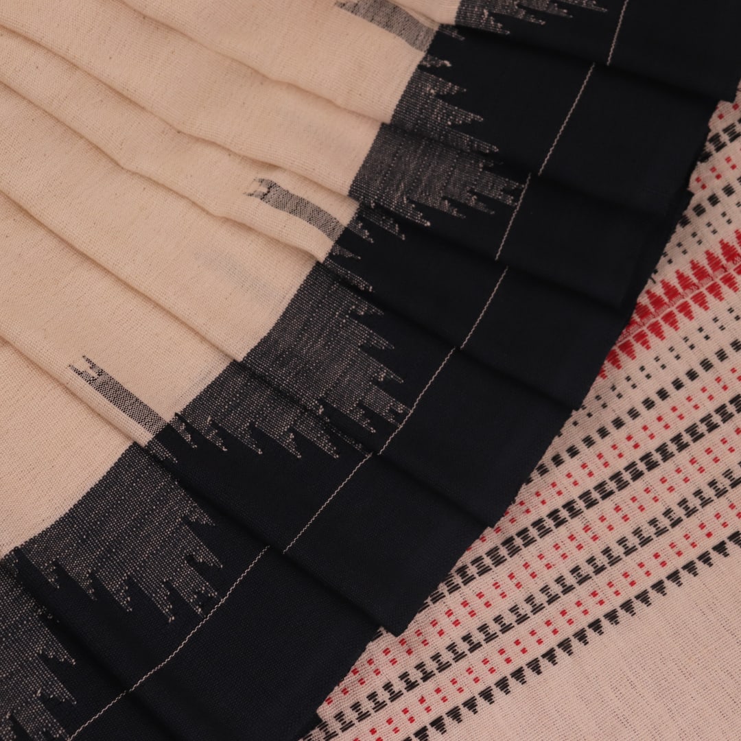 Full view of a white cotton Kotpad saree with a maroon border and butta pattern