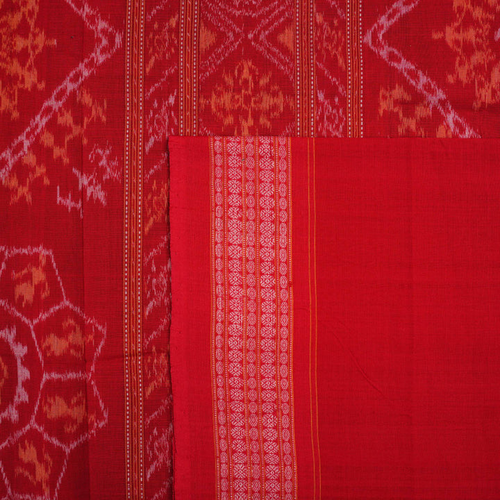 Full layout of a maroon and red Sambalpuri cotton saree displaying the complete body motifs and border.