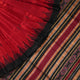 Detailed view of hand-woven silk fabric texture and butta patterns on a red Sambalpuri saree.