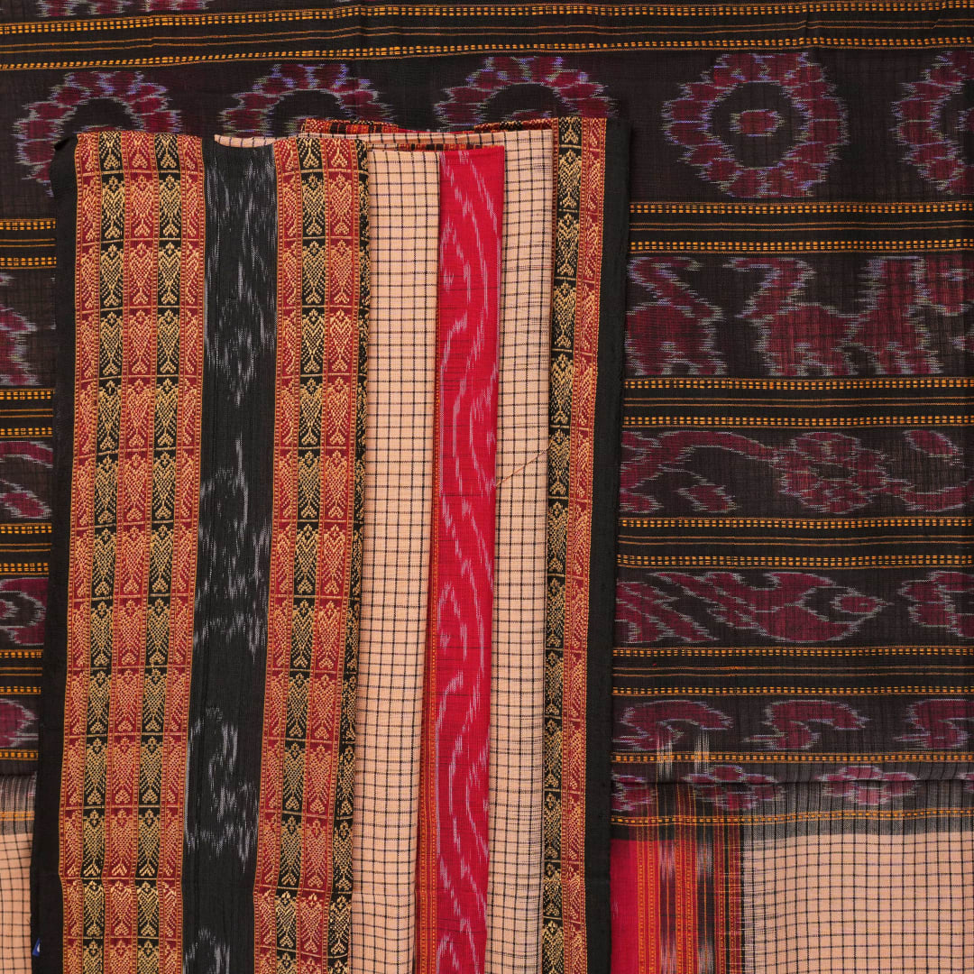 Model elegantly draped in a cream and black Sambalpuri cotton handloom saree with traditional ikat motifs.