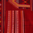 Full length view of a handloom grey and red striped Dolabedi cotton saree.