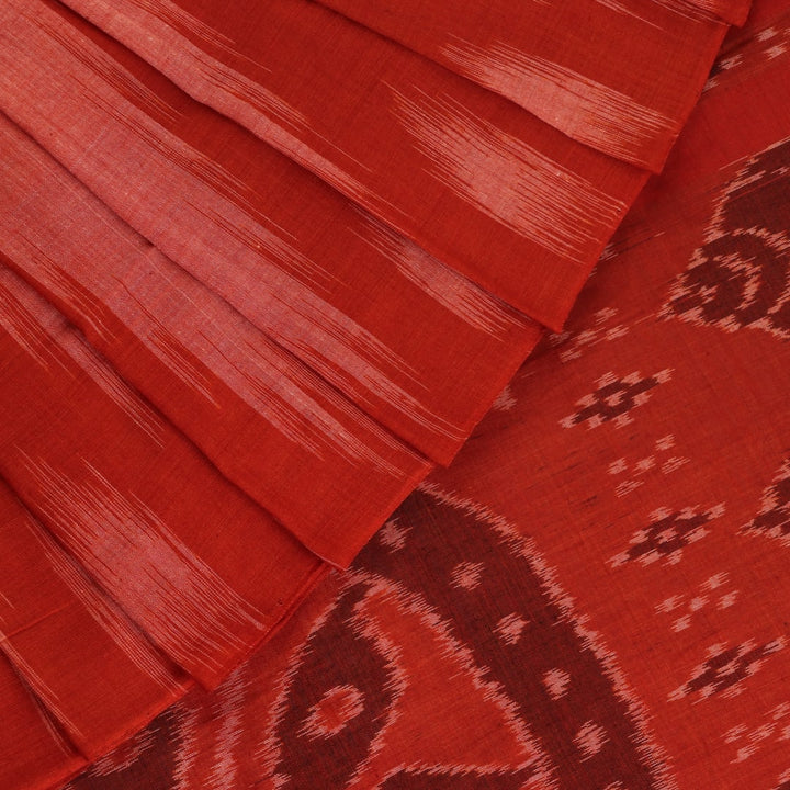 Styling view of a plain multi-color & rust Sambalpuri cotton saree.