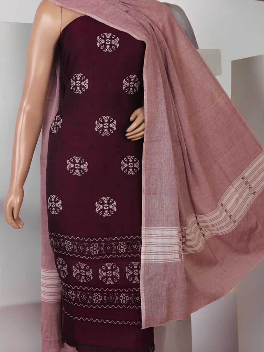 Close-up of Bomkai cotton dress material's matching blouse piece in brown with subtle purple details.