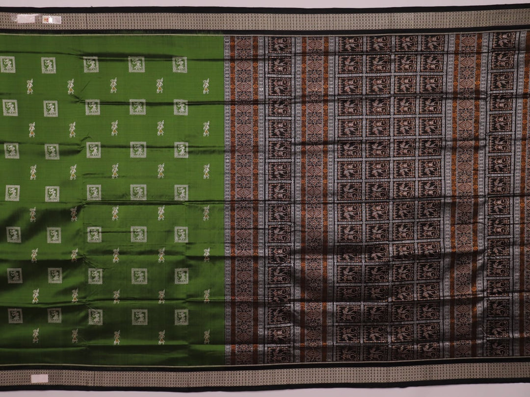 Close-up view of the silken texture of the Sambalpuri silk saree, showcasing green and black woven motifs.