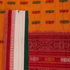 Full view of a white and green cotton handloom Bomkai saree with butta pattern.