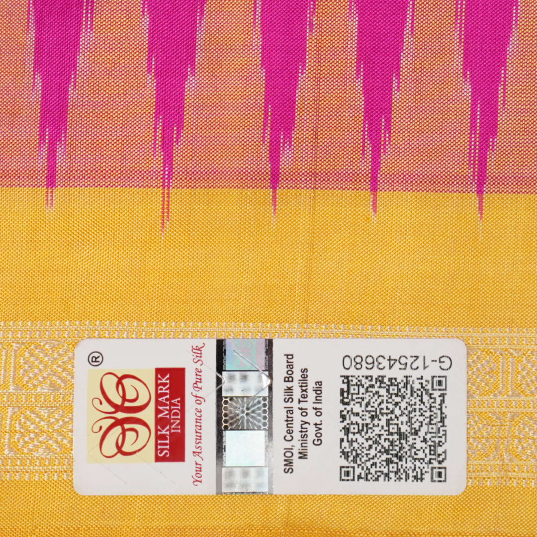 Close-up of the luxurious Bomkai silk saree fabric texture and weave in pink and yellow.